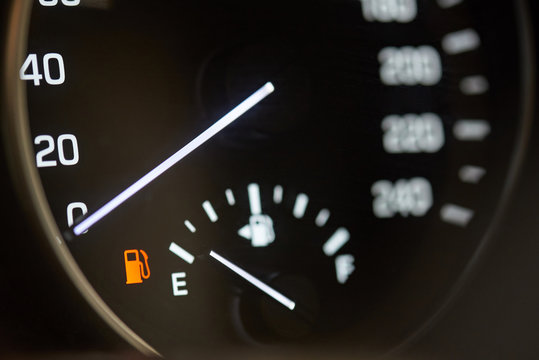 Car with empty gas tank - Powered by Adobe