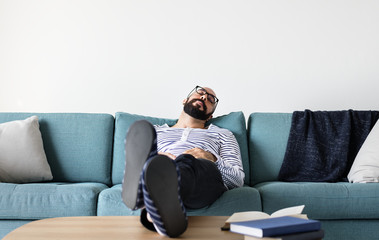 Obraz premium Man sleeping on the couch