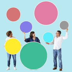 Diverse people holding colorful blank circles