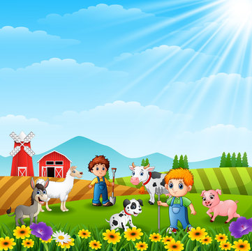 The young farmers in the farm with the animals