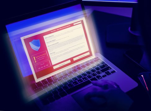 Computer hacking on a laptop