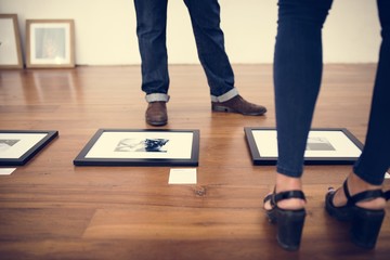 Photo frames on wooden floor