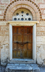 Fototapeta na wymiar Closed door of historic building