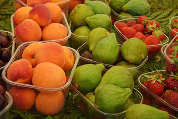 Figs, apricots and strawberries on display at the market in Italy
