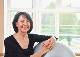 Happy senior woman resting after exercise