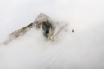 Going up in the fog with cable car