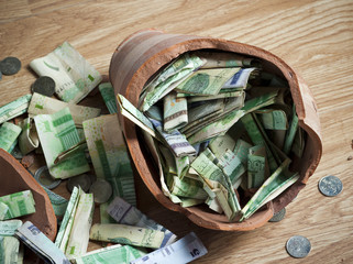 Money box with banknotes & coins
