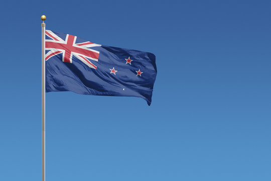 New Zealand Flag of in front of a clear blue sky