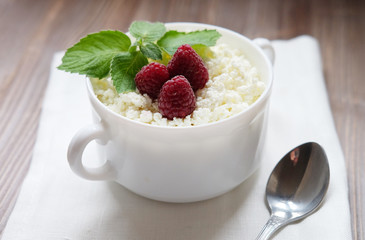 Time for breakfast. Cottage cheese with raspberries