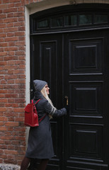 girl opening the door