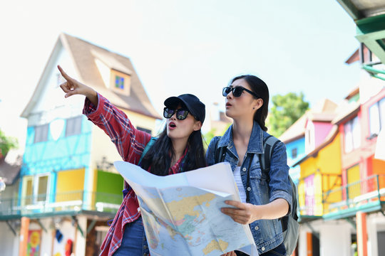 Travel and relaxing Concepts, Tourists are taking photos in the city. Asian girls are happily traveling. Beautiful girl is relaxing Travel. Asian girls are traveling in Asia.