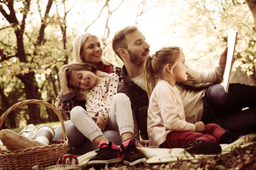Family enjoying on picnic together.