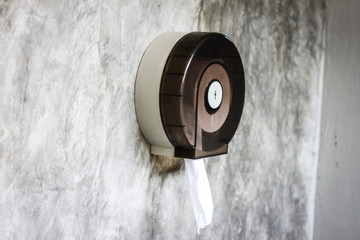 Bathroom tissue or toilet paper hanging white box on the wall.