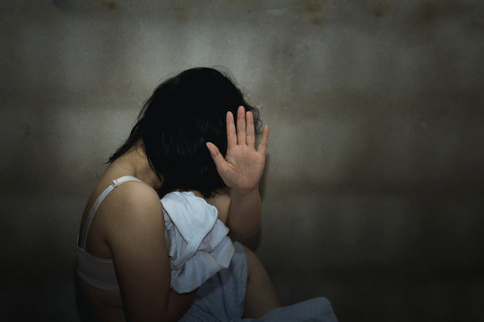 Violence and rape concept,concept photo of sexual assault,traumatized woman