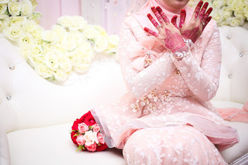 Fototapeta na wymiar Malay Wedding bride during the marriage ceremony. Selective Focus. Tones Image.