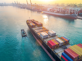 aerial view of containers ship vessel arrival approach to the main entrance gate od an...