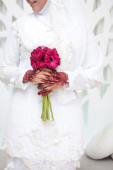 Wedding flowers ,Woman holding colorful bouquet with her hands on wedding day. Selective focus.