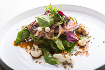 Cooked roastbeef served with herbs