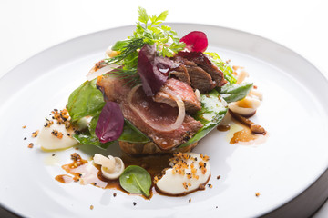 Cooked roastbeef served with herbs