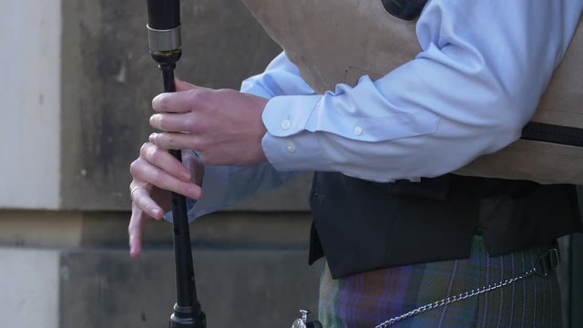Playing a bagpipe on the street