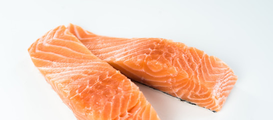 Slices of the fresh salmon on white
