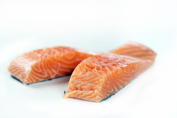 Slices of the fresh salmon on white