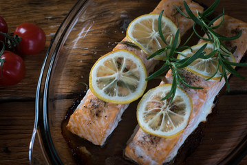 Grilled salmon on grill closeup with lemon 