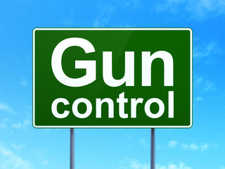 Privacy concept: Gun Control on green road highway sign, clear blue sky background, 3D rendering