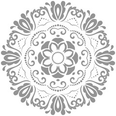 Oriental vector pattern with arabesques and floral elements. Traditional classic silver round ornament. Vintage pattern with arabesques