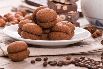 Hazelnut shortbread sandwiches filled with chocolate cream. 