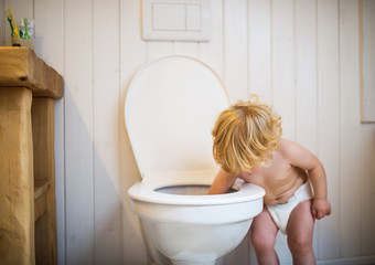 Cute toddler boy in the bathroom.