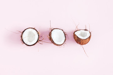 Coconut background. Fresh coconuts on pink background. Flat lay, top view