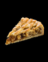 piece of freshly baked apple pie over black background