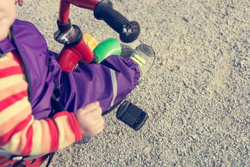 Fototapeta na wymiar Closeup of child feet pushing a pedal on bike.