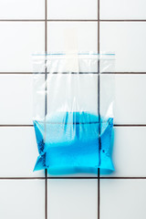 ziplock plastic bag with water hanging on wall, earth day concept