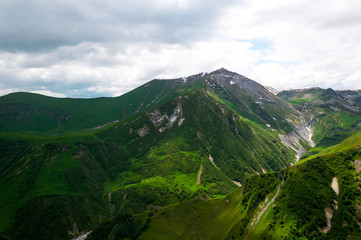 Fototapeta premium The majestic and beautiful view of Caucasian Mountains in summer time. Gudauri, Georgia.