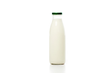 close-up view of glass bottle with fresh milk isolated on white