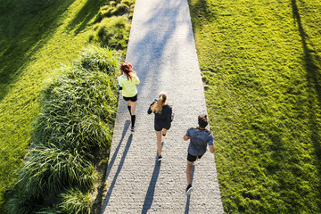 Young athtletes in the city running in park. © Halfpoint