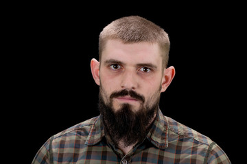 Obraz premium Close-up portrait of a brutal bearded man