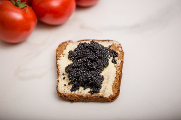Black caviar on a slice of bread