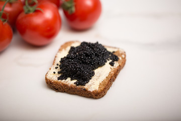 Black caviar on a slice of bread