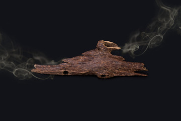 Close Up Macro Shot Of Sticks Of Agar Wood Or Agarwood Isolated On Black Background  With the smoke The Incense Chips Used For Arabic Oud Oils Or Bakhoor