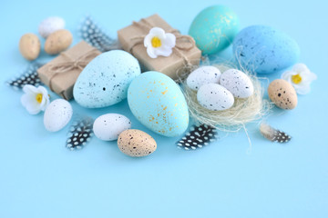Fototapeta na wymiar Easter eggs on a blue background. Festive easter background