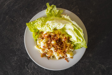 Potato dumplings with sheep cheese (slovak: bryndzove halusky) sprinkled with cooked bits of smoked pork fat
