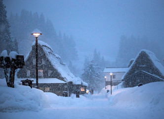 The only street in Ainokura covered in deep snow at dusk