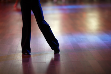 Fototapeta premium Closeup of dancer's legs as they do the ballroom dance