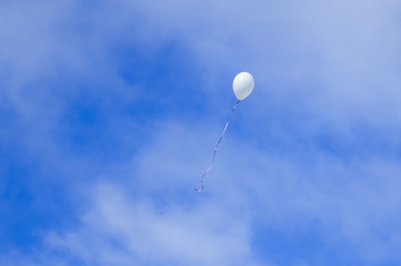 White balloon in the blue sky