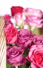 Beautiful pink and red roses in a basket.