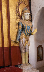Myanmar, Bagan. Dvarapala guardian statue inside Ananda Phaya Temple.