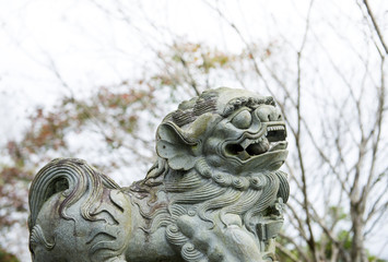 Fototapeta na wymiar Lion statue stone in front of temple